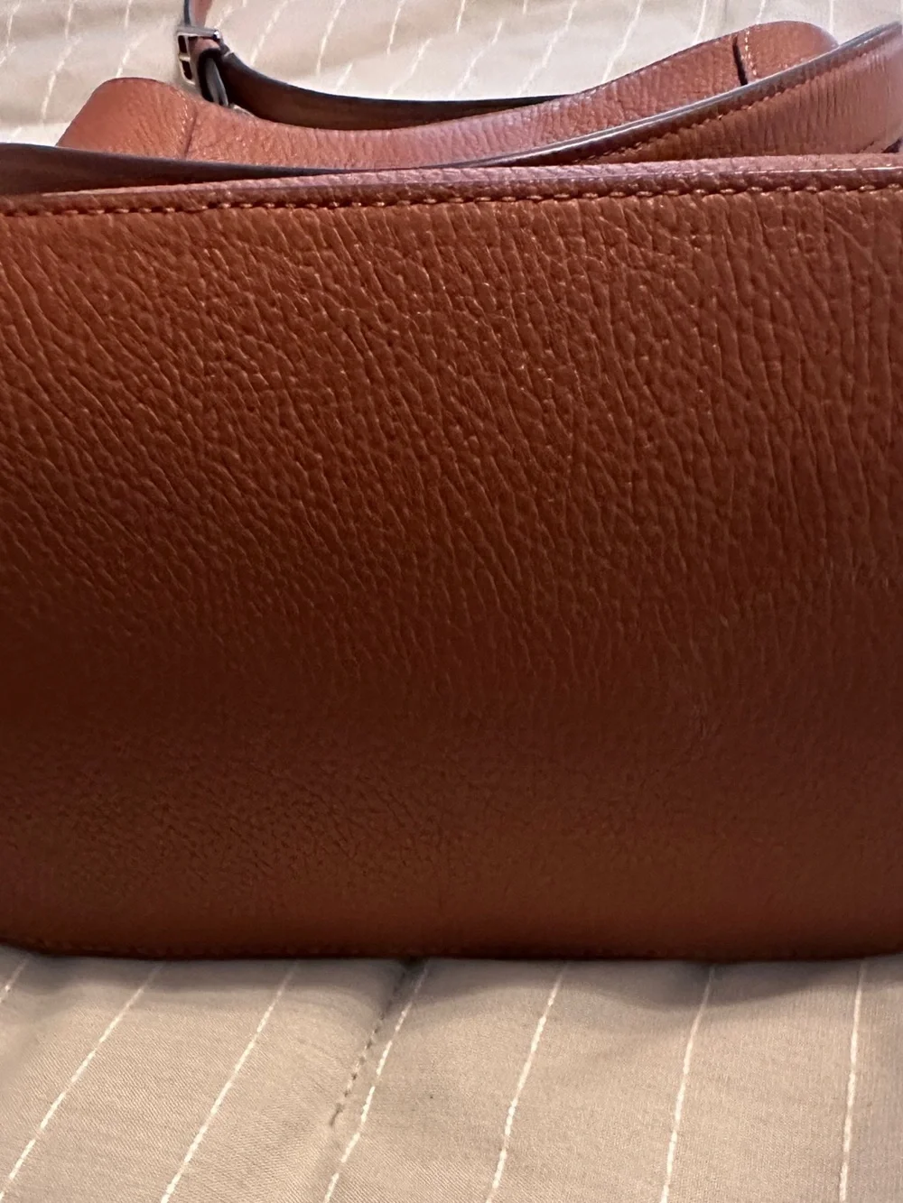 Barely carried, chestnut colored, Kate Spade crossbody with top handle